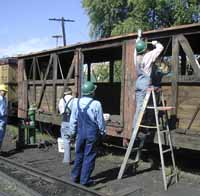 Friends volunteers restore a boxcar, 2003.  Photo by Tom Cardin